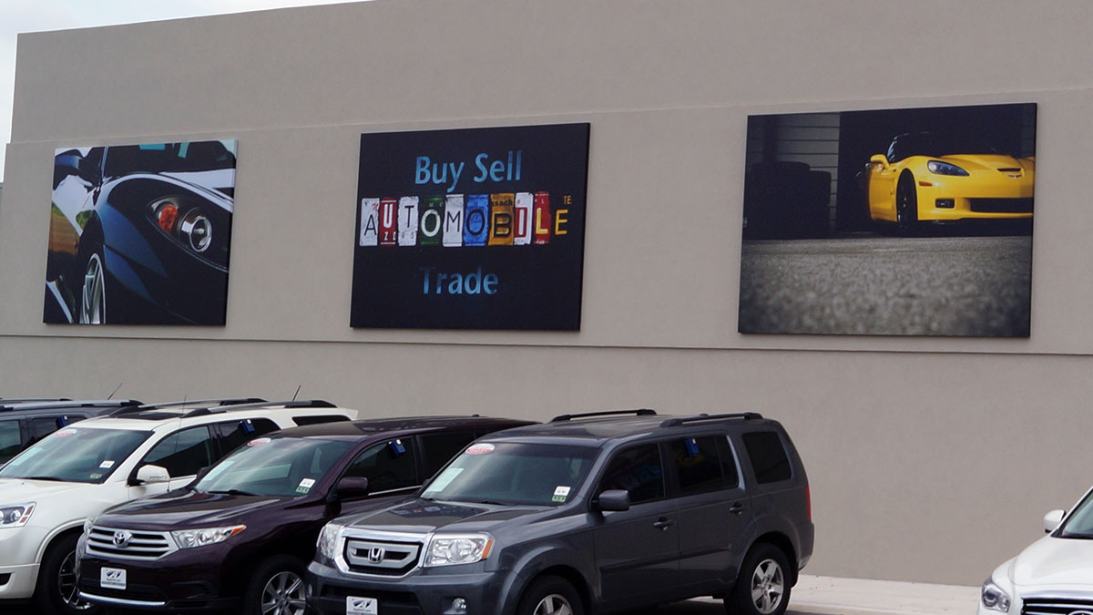 Auto dealer wall graphics installed by Texas Custom Signs